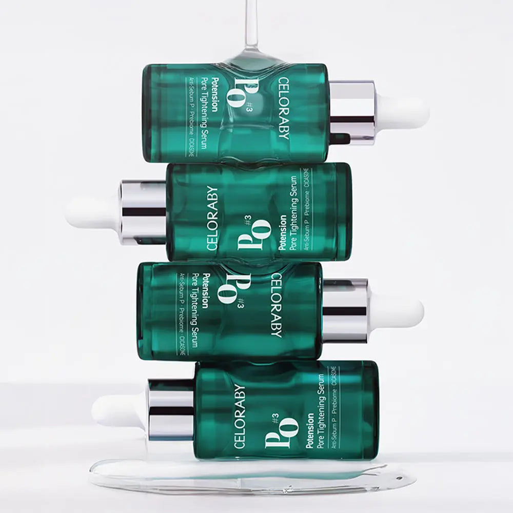 Stack of green serum bottles with visible branding on a white background